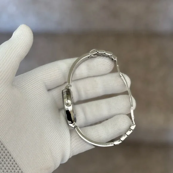 Movado Silver and Gold-Tone Watch
Trend Bangle Watch, 34mm - Picture 10 of 11